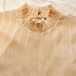 sheer beige blouse with stitching detail